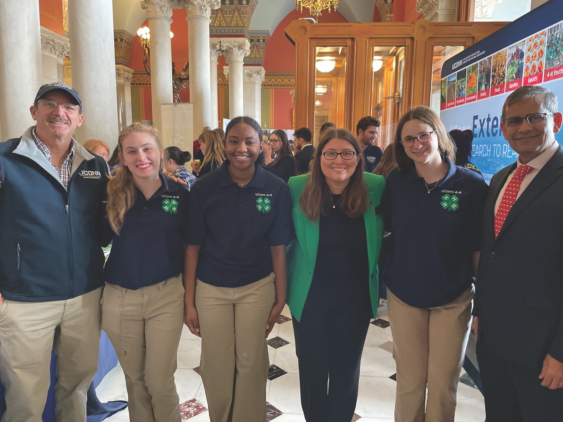 group of people standing in Connecticut state capitol