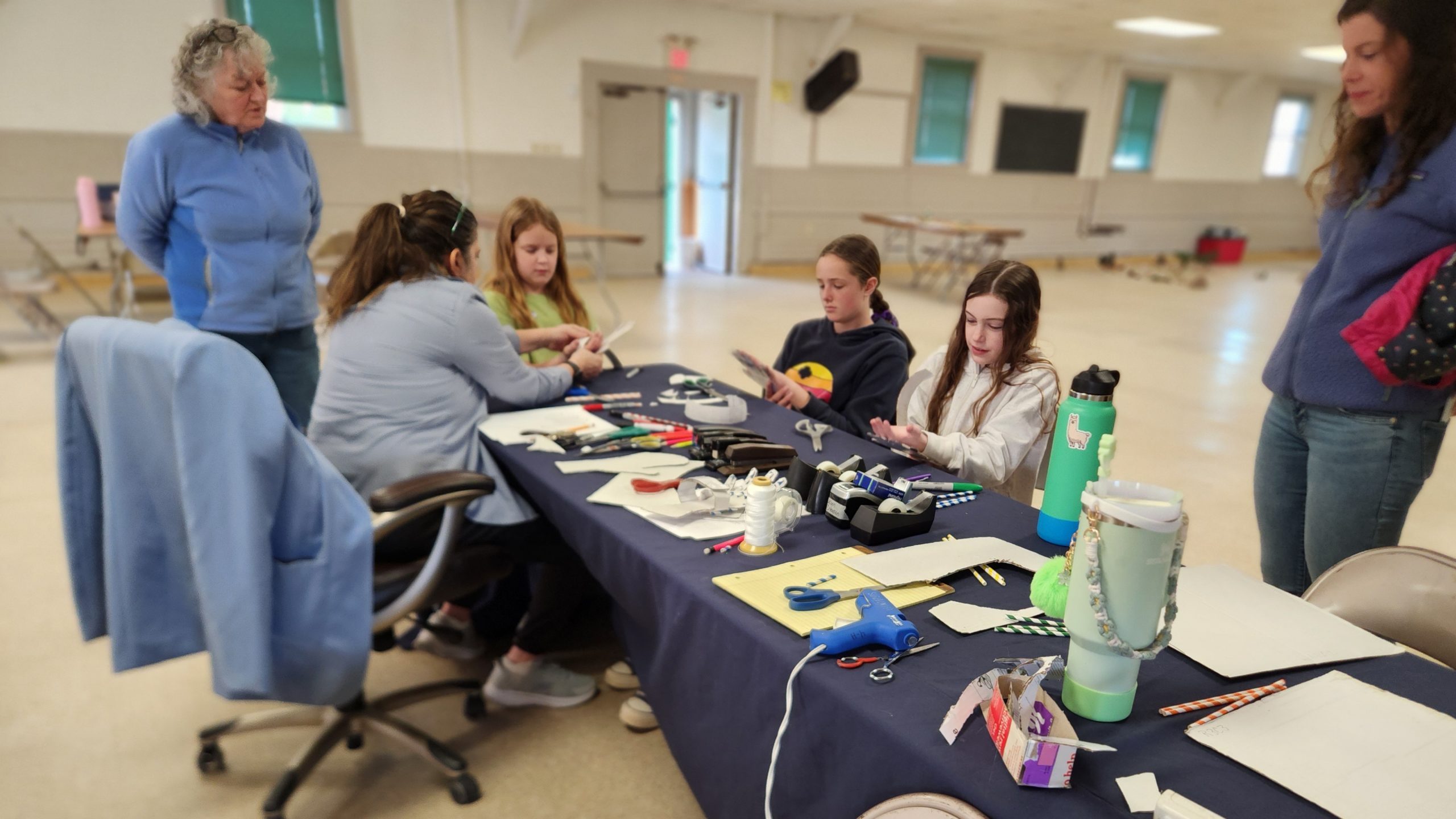Youth at table with crafts and STEM projects