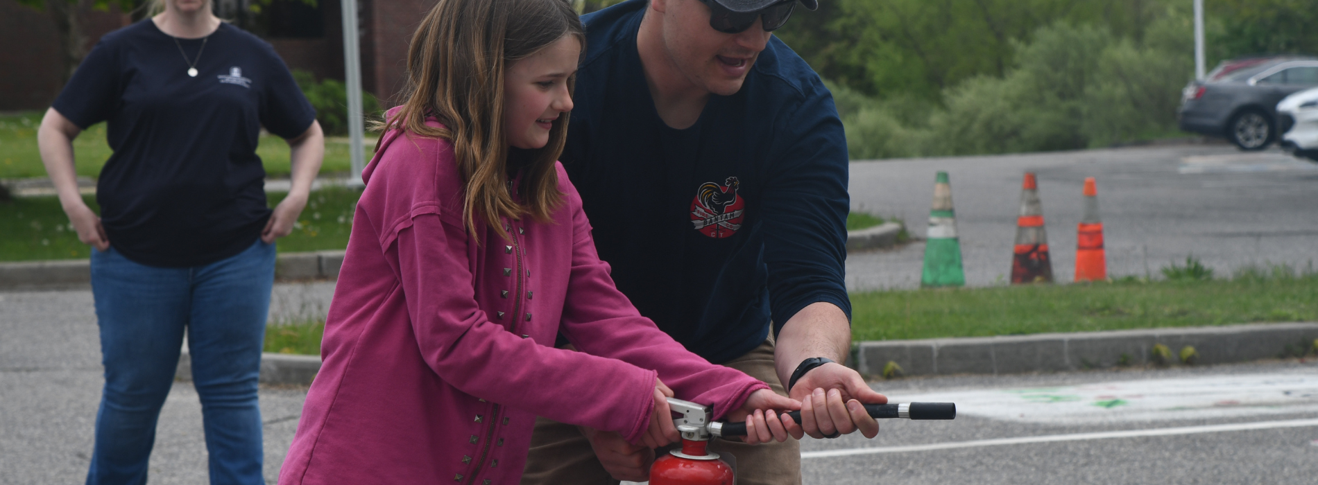 Youth and man holding a fire extinguisher